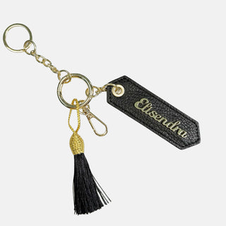 Porta chiavi Charm con nappa e anello Liquirizia Pelle Martellata Oro