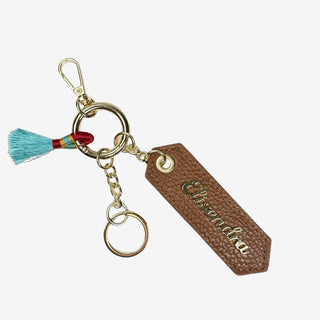 Porta chiavi Charm con nappa e anello Caramel Pelle Martellata Oro