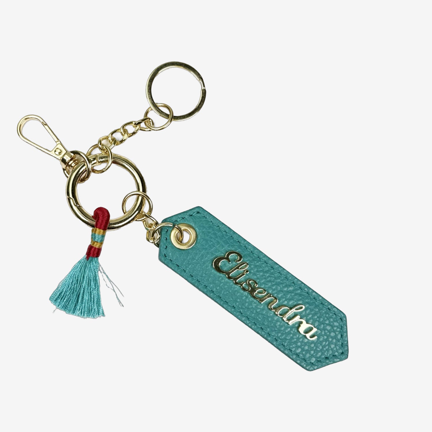 Porta chiavi Charm con nappa e anello Pavone Pelle Martellata Oro